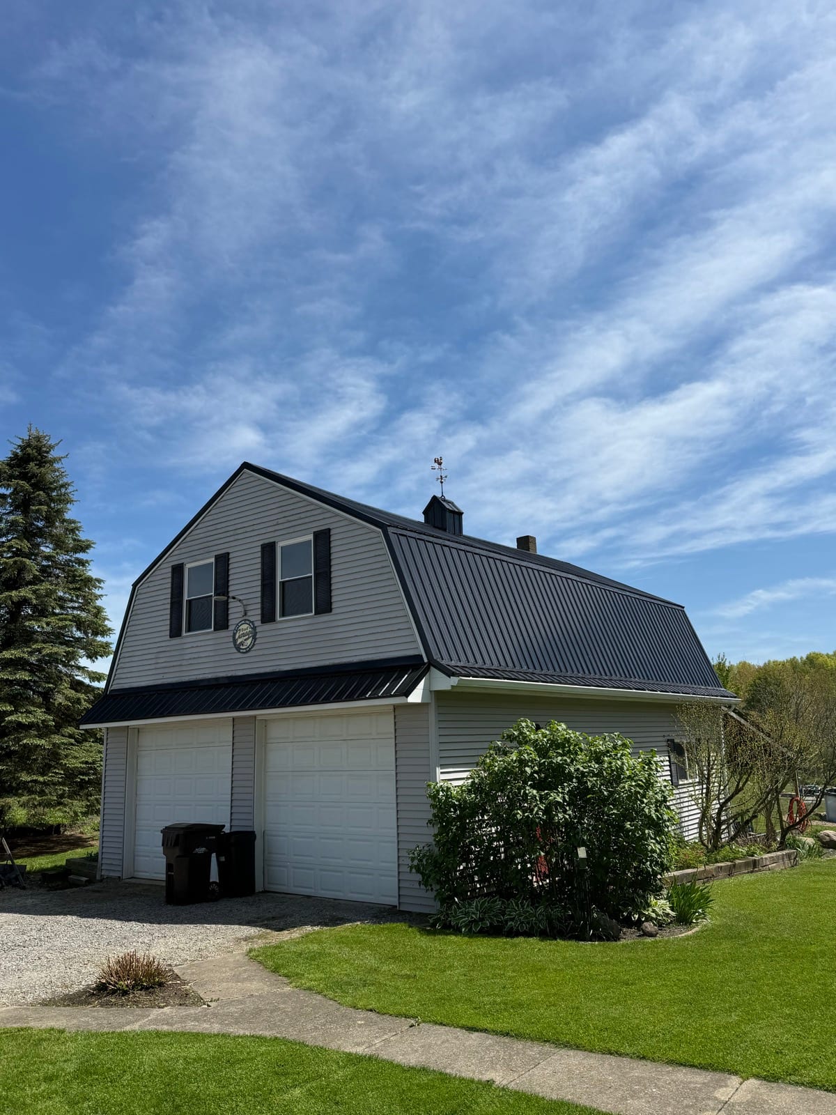 Home with a new standing-seam metal roof in the North Pittsburgh area